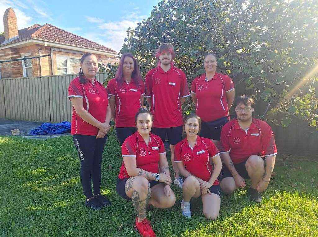 The Dust Devilz team in red uniforms